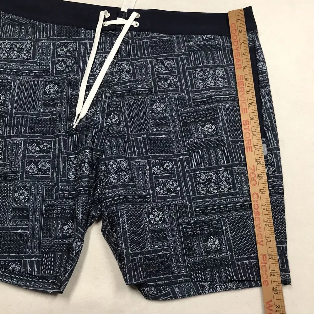 RHONE R&R Swim Trunks Men 38 Blue Floral Print Poly Stretch Mesh Lined